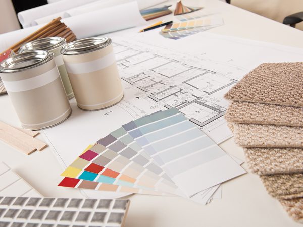 Office of interior designer with paint and color swatch on the desk