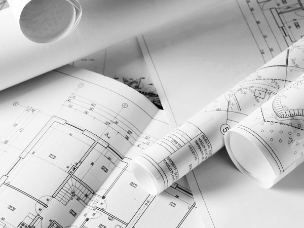 heap of design and project drawings on  table  background.